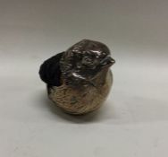 A large silver pin cushion in the form of a chick
