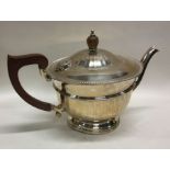 A good silver panelled teapot on pedestal foot. Bi