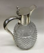 A heavy Victorian silver and glass claret jug. (Cr