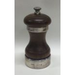 A heavy silver mounted wooden pepper grinder. Lond