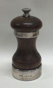 A heavy silver mounted wooden pepper grinder. Lond