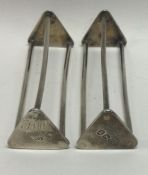 A rare pair of George III silver knife rests. Lond