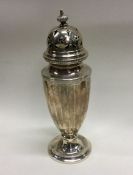 A circular silver half fluted sugar caster. Birmin