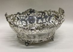 An attractive pierced silver basket decorated with