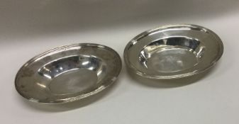 A heavy pair of George III silver dishes. London 1