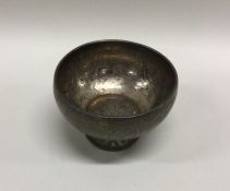 A silver engraved bowl decorated with birds. Appro