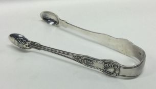 A pair of heavy silver King's pattern sugar tongs.