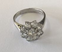 A large diamond circular daisy head cluster ring i