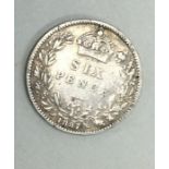 A Queen Victoria sixpence dated 1884.