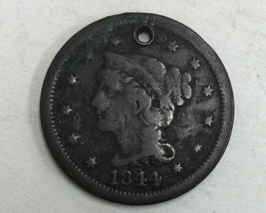 A large 1 cent dated 1844 (holed).