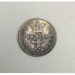 A Queen Victoria 4 pence dated 1871.