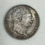 A George III Sixpence dated 1817.