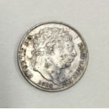 A George III Sixpence dated 1816.