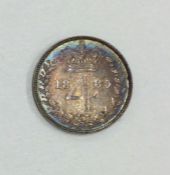 A Queen Victoria 4 pence dated 1885.