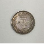A Queen Victoria 4 pence dated 1877.