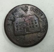 An 'Overseers of The Poor' token dated 1815.