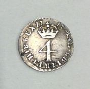 A George I silver 4 pence dated 1717.