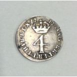 A George I silver 4 pence dated 1717.