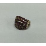 A large ruby an diamond mounted cluster ring set i