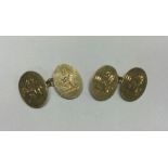 A good pair of 18 carat gold oval cufflinks with c