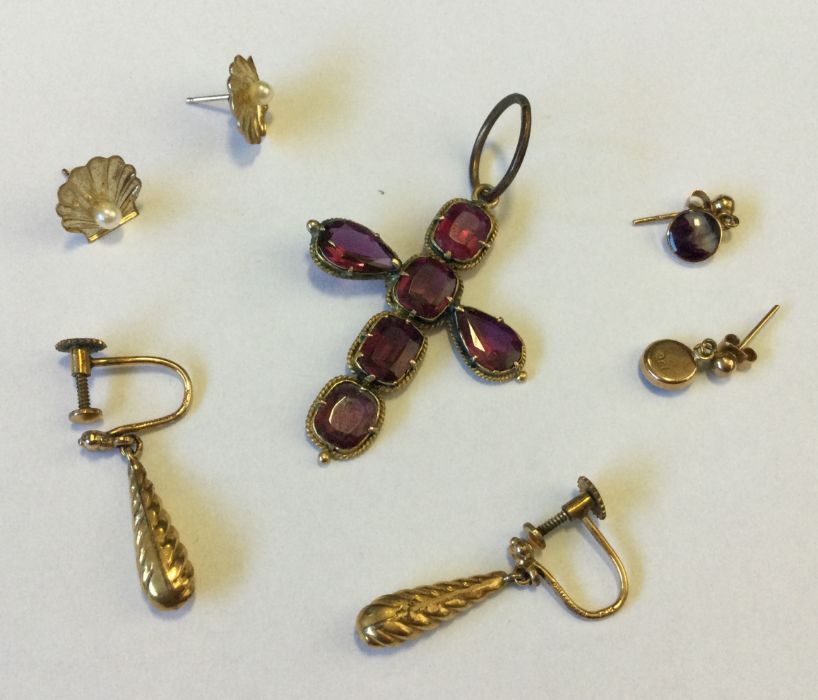 An Antique gem set cross together with three pairs