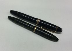 A large Mont Blanc fountain pen together with one