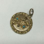 A good Georgian gold circular locket with loop top