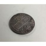 An 1887 Crown (coin). Est. £15 - £20.