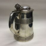 A large George III silver lidded tankard. London 1