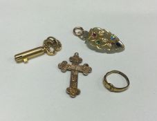 A 15 carat gold watch key together with a cross et