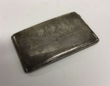 A heavy Iraqi silver cigarette case engraved with