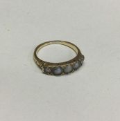 An 18 carat gold pearl half hoop ring with diamond