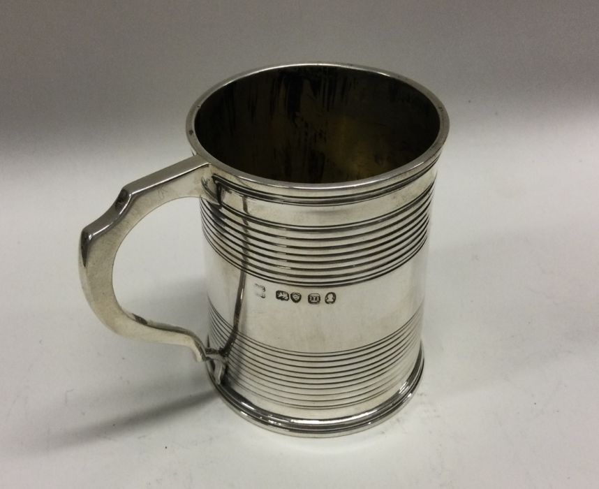 A George III silver mug of reeded design. London 1