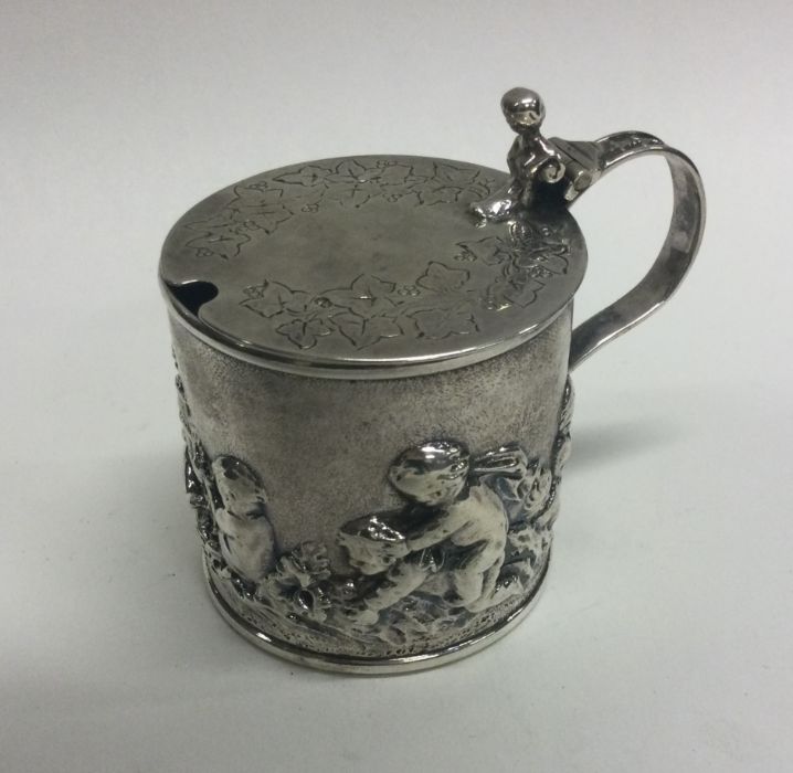 A rare and unusual silver mustard pot with chased