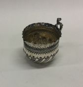 A Victorian silver cream jug with crimped rim. App