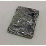 A bright cut silver card case with chased cherub d
