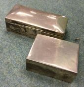 Two silver cigarette boxes with hinged tops. Est.