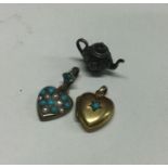 A small Victorian gold heart shaped locket togethe