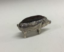 A silver pin cushion in the form of a pig. Chester