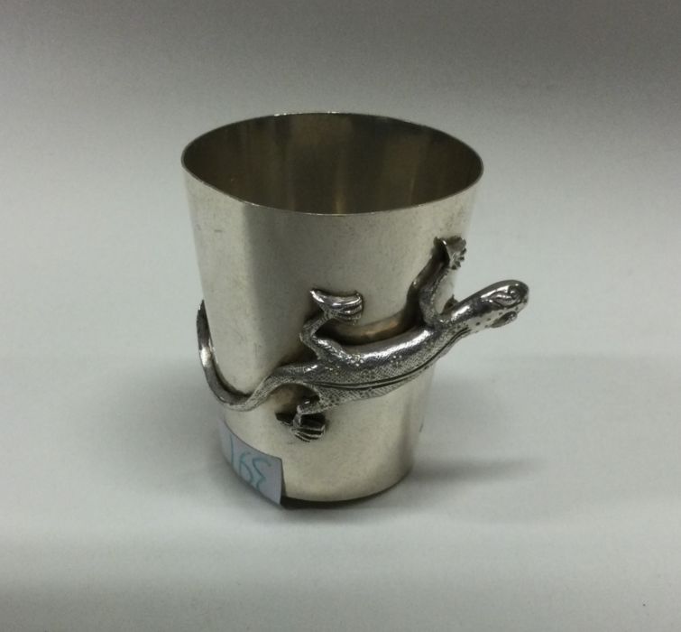 A Chinese chased silver cup decorated with lizards
