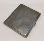 A heavy engine turned silver cigarette case. Appro