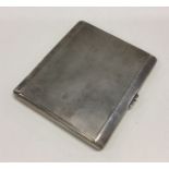 A heavy engine turned silver cigarette case. Appro