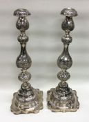 A large pair of chased Judaica silver Sabbath candlesticks