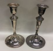A large pair of silver candlesticks. Sheffield 196
