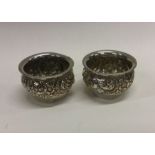An attractive pair of salts decorated with flowers
