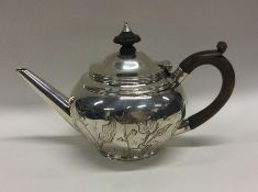 A good bachelor's silver chased teapot. London 190