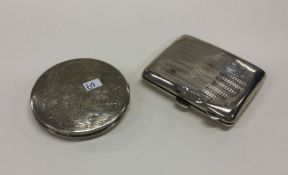 An engine turned silver cigarette box together wit