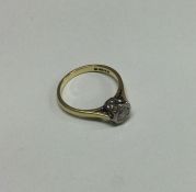 An 18 carat gold diamond mounted single stone ring