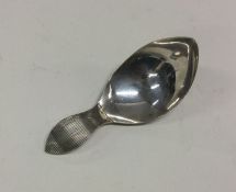 An Antique Dutch silver caddy spoon of hammered de