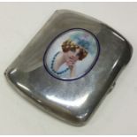 A silver and enamel cigarette case with lady to ce